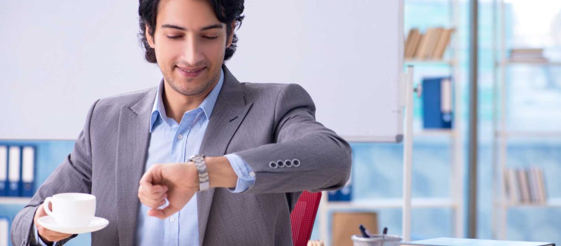 Professional Certification, Man in suit checking his watch.